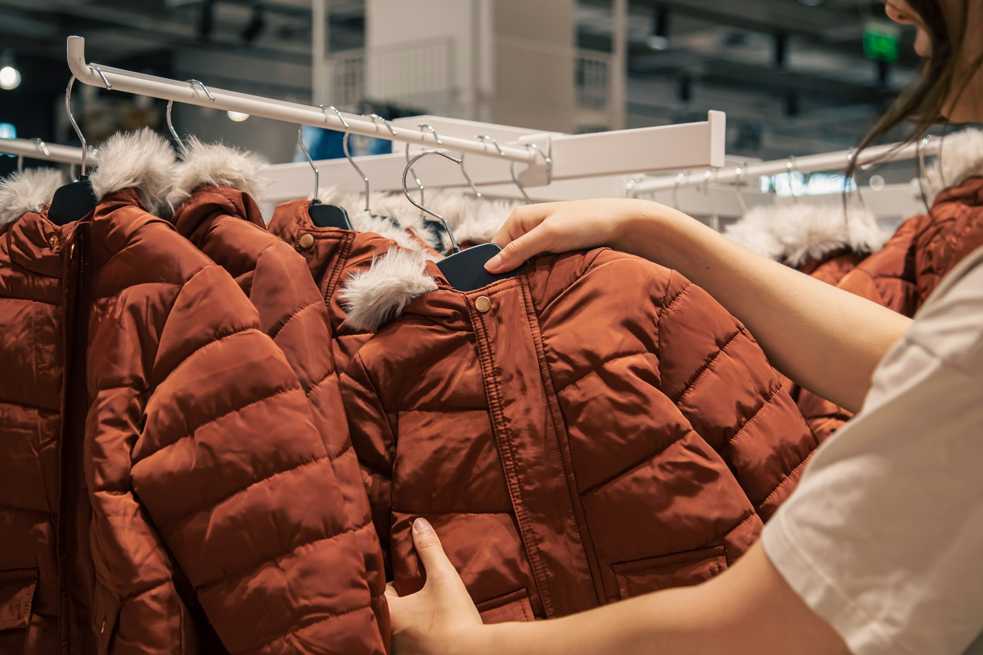 Children's jackets on hangers in a clothing store.